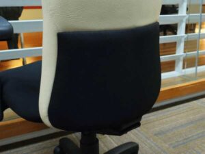 office chair Cream leather backrest, black cloth cushion, with arms.