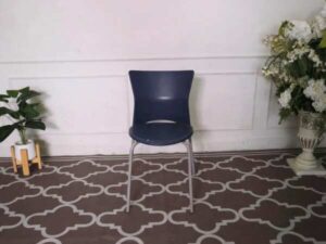 Blue cushioned chair, steel legs, no arms.