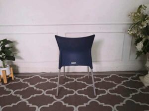 Blue cushioned chair, steel legs, no arms.