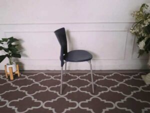 Blue cushioned chair, steel legs, no arms.