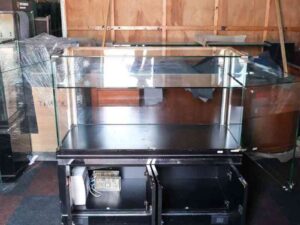 Jewelry cabinet, glass cabinet to display products Rectangular shape glass door open Black wooden base with silver trim