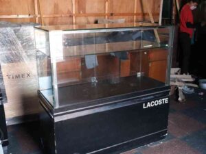 Jewelry cabinet, glass cabinet to display products Rectangular shape glass door open Black wooden base with silver trim