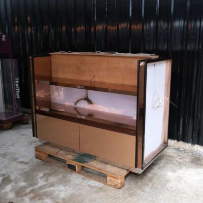 Product shelves, 2 sides, 2 shelves on each side, 2 drawers, wooden frame with gold stainless steel edges. There is a light sign on the side.