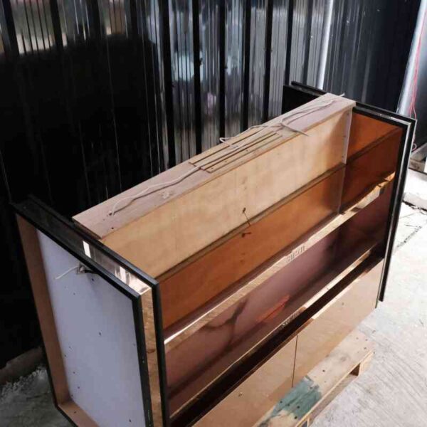 Product shelves, 2 sides, 2 shelves on each side, 2 drawers, wooden frame with gold stainless steel edges. There is a light sign on the side.