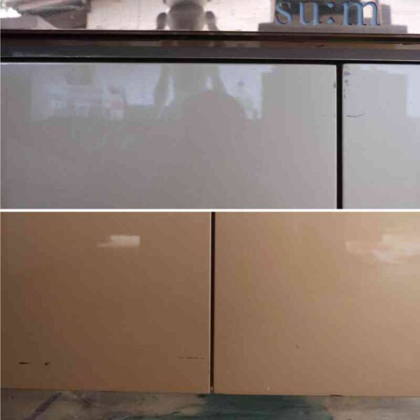 Product shelves, 2 sides, 2 shelves on each side, 2 drawers, wooden frame with gold stainless steel edges. There is a light sign on the side.
