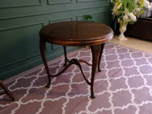 Round table, carved wood European work comes from Germany.