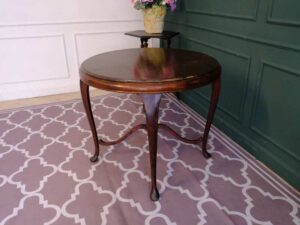 Round table, carved wood European work comes from Germany.
