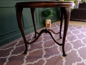 Round table, carved wood European work comes from Germany.