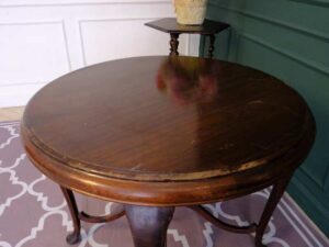 Round table, carved wood European work comes from Germany.