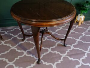 Round table, carved wood European work comes from Germany.