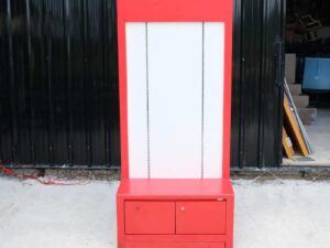 Tall wooden product shelf, open front, red-white wooden frame, has 2 storage drawers.