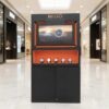 Jewelry display case, glass showcase, 2-tier display case, black wooden frame, 2 open doors, 1 glass drawer.