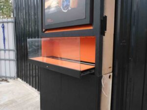 Jewelry display case, glass showcase, 2-tier display case, black wooden frame, 2 open doors, 1 glass drawer.