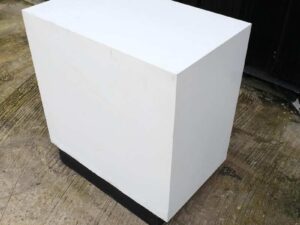 White wooden frame shelving unit with plastic shelves, 15 compartments.