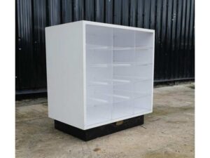 White wooden frame shelving unit with plastic shelves, 15 compartments.