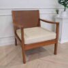 Chair with armrests, wooden frame. Seat cushion made of fabric.