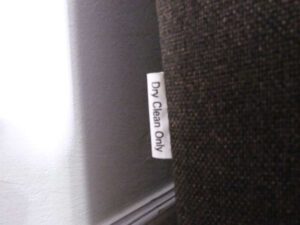 L sofa, 3 seats, wooden frame, steel legs, brown, brand Dry Clean Only.