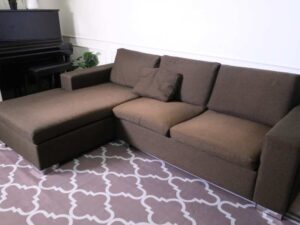 L sofa, 3 seats, wooden frame, steel legs, brown, brand Dry Clean Only.