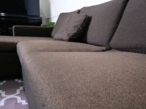 L sofa, 3 seats, wooden frame, steel legs, brown, brand Dry Clean Only.