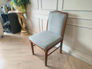 Light blue fabric wooden chair, beautiful design.