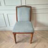 Light blue fabric wooden chair, beautiful design.