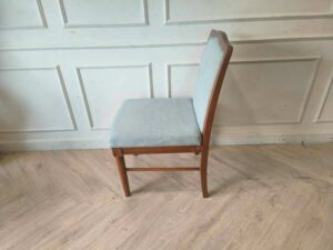 Light blue fabric wooden chair, beautiful design.
