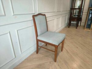Light blue fabric wooden chair, beautiful design.