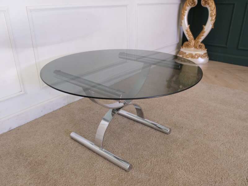 Center table, round glass top, silver steel legs.