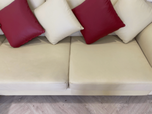 3-seat L-shaped corner sofa, wooden frame, leather cushion, cream color, with pillows