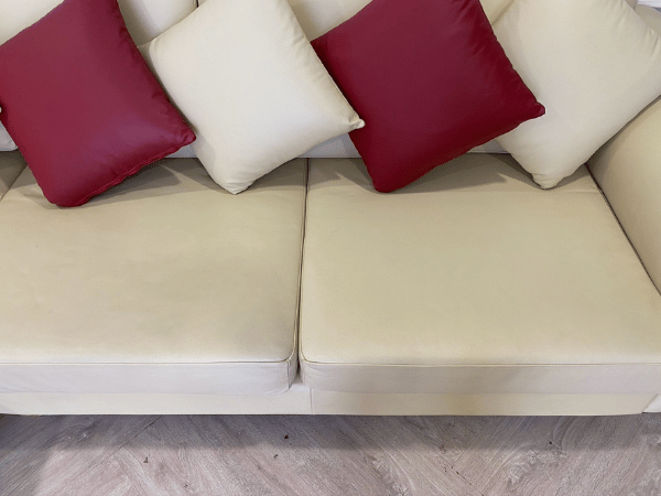 3-seat L-shaped corner sofa, wooden frame, leather cushion, cream color, with pillows