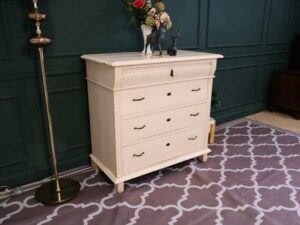 Storage cabinet with 4 drawers, wooden frame, cream color, European work from Germany.