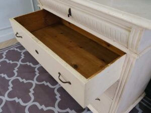 Storage cabinet with 4 drawers, wooden frame, cream color, European work from Germany.