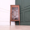 Mahogany corner display cabinet with 1 glass door.