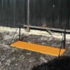 Hanging shelf, black steel frame, wooden top.