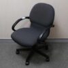 Office chair with gray fabric cushion, brand UB-Haworth.