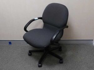 Office chair with gray fabric cushion, brand UB-Haworth.