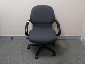 Office chair with gray fabric cushion, brand UB-Haworth.