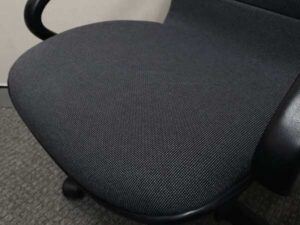 Office chair with gray fabric cushion, brand UB-Haworth.