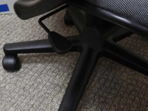 Office chair with gray fabric cushion, brand UB-Haworth.