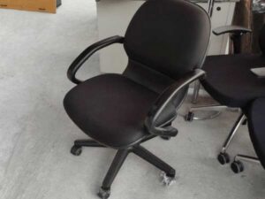 Office chair with gray fabric cushion, brand UB-Haworth.