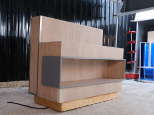 Product shelf, display stand, 1 side, wooden frame, brown wood pattern, has 1 compartment.