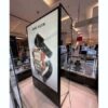 Light Box, product advertising sign, tall lighted sign on 2 sides, one side is a mirror.