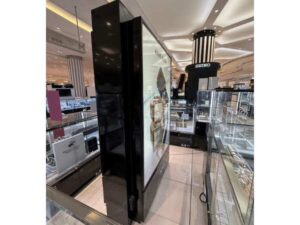 Light Box, product advertising sign, tall lighted sign on 2 sides, one side is a mirror.