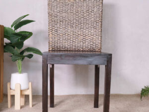 An all-wood chair with a beautiful frame and a chic woven rope backrest.