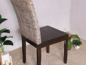 An all-wood chair with a beautiful frame and a chic woven rope backrest.
