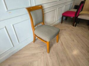 Wooden chair, cream colored fabric cushion, beautiful design.