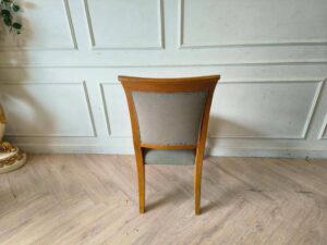 Wooden chair, cream colored fabric cushion, beautiful design.