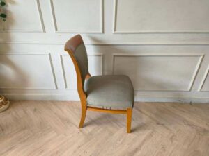 Wooden chair, cream colored fabric cushion, beautiful design.