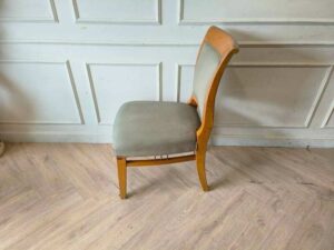 Wooden chair, cream colored fabric cushion, beautiful design.