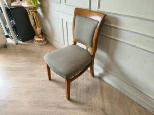 Wooden chair, cream colored fabric cushion, beautiful design.